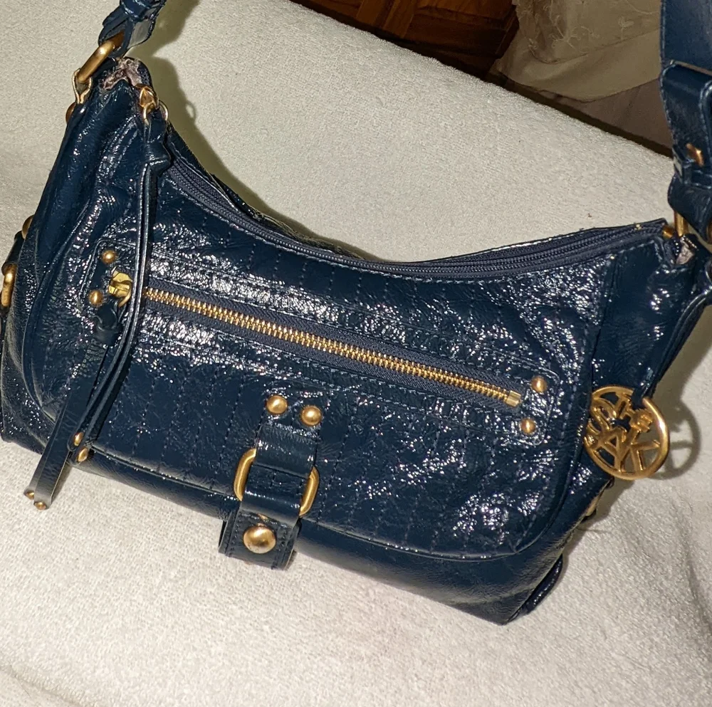 The  Sak navy blue patent leather hobo bag.